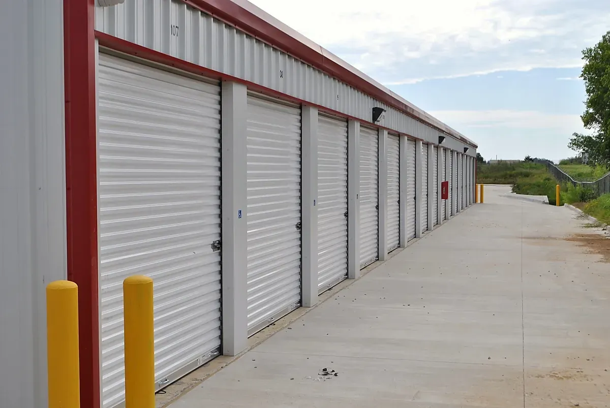 White Storage Unit building with red trim 